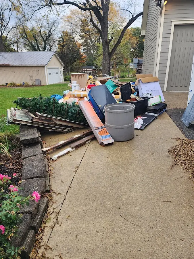 Dumpster being loaded with debris for Estate Cleanout Dumpster Rental in Westfield